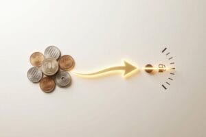 ガソリンスタンドの小銭払い、硬貨の束から給油ノズルへ発光する矢印の図解